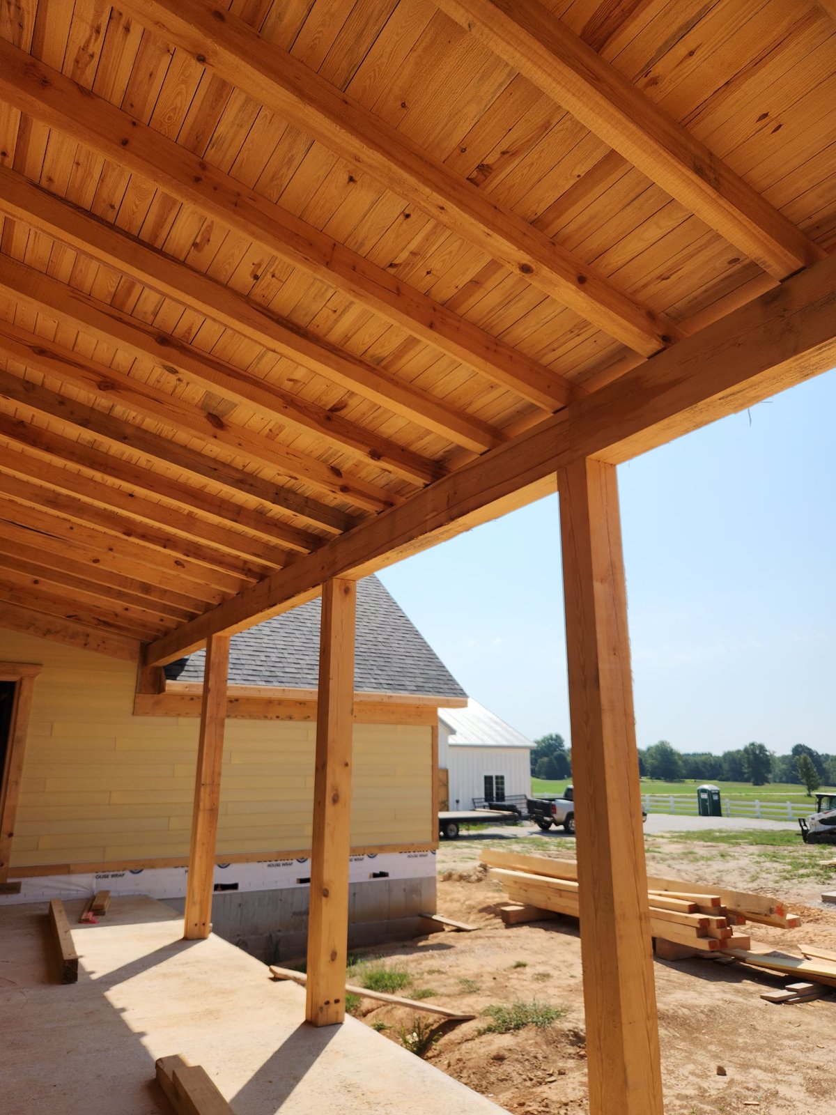 Timber porch with tongue and groove ceiling on a new build