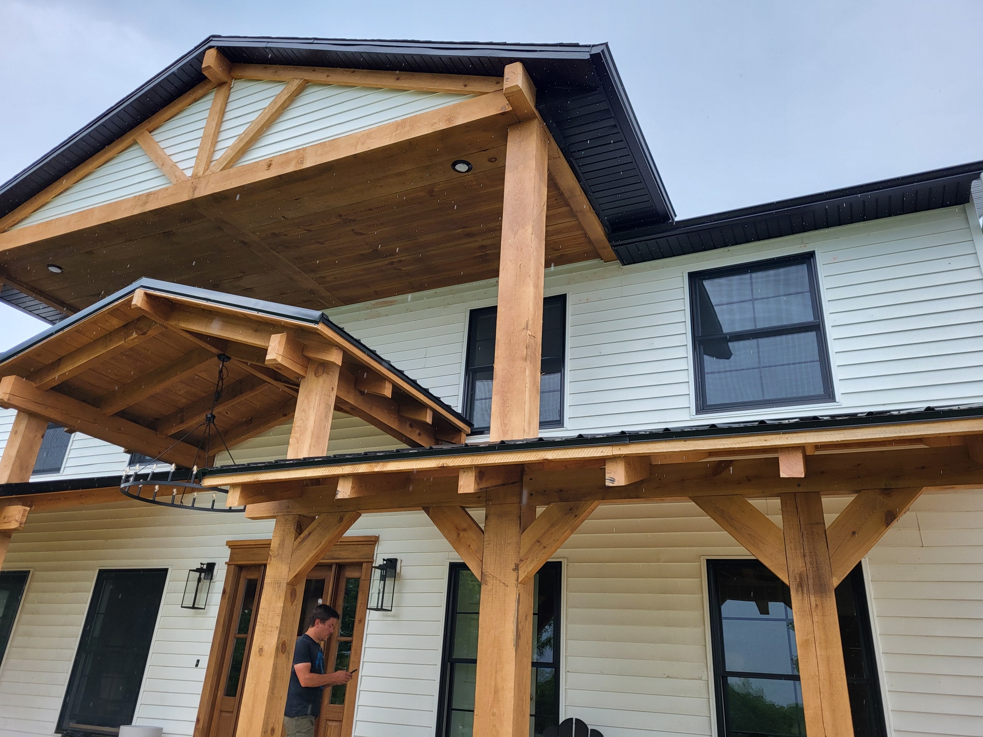 Timber frame porch with gabled roof