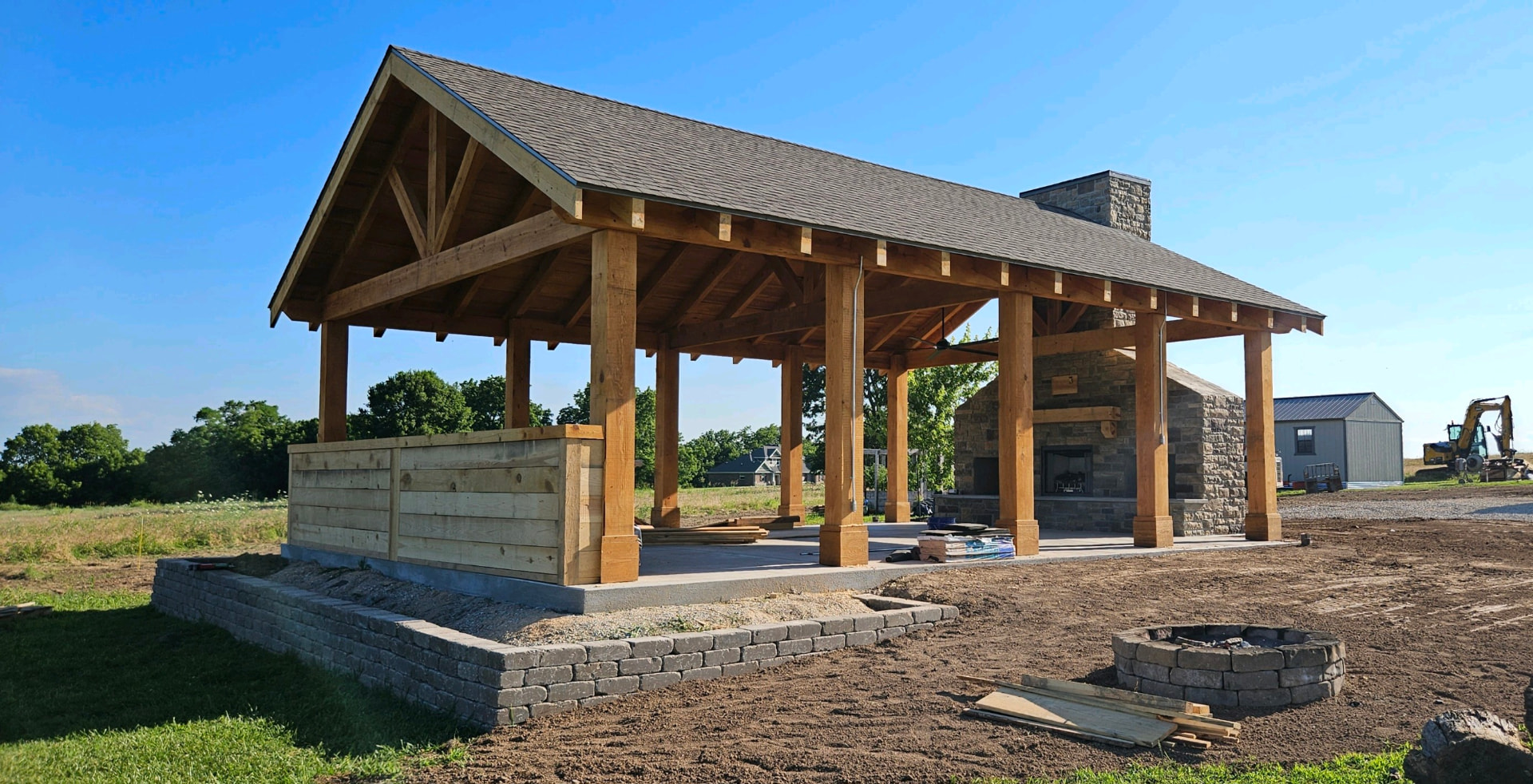 Large gabled timber pavilion on a stone base