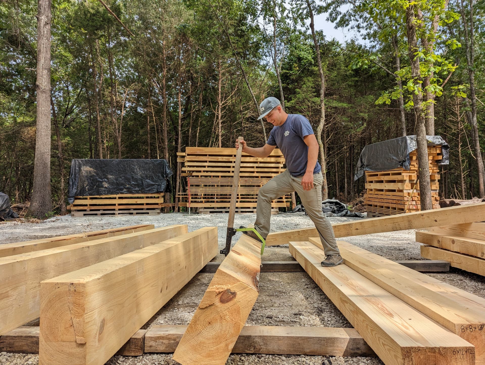 Grant Simon inspecting timbers before a delivery
